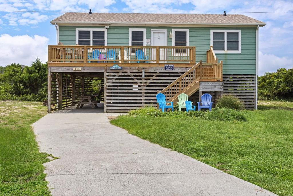 a house with a deck with chairs on it at 6153 - Seascape in Nags Head