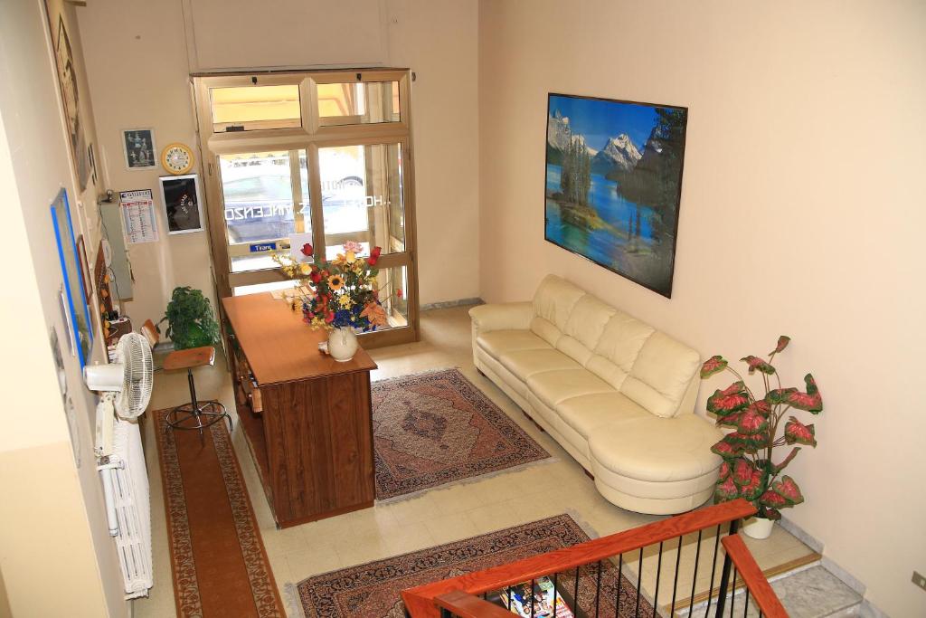 a living room with a couch and a table at Hotel San Vincenzo in Soverato Marina