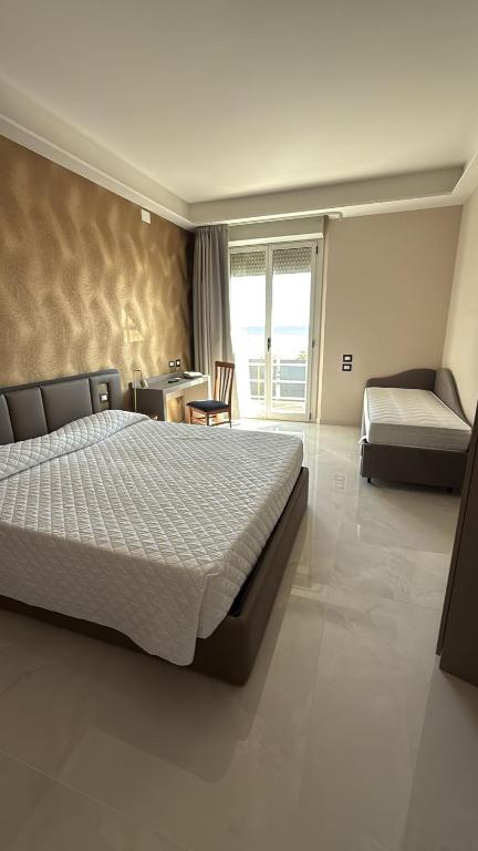 Postel nebo postele na pokoji v ubytování Hotel Kursaal