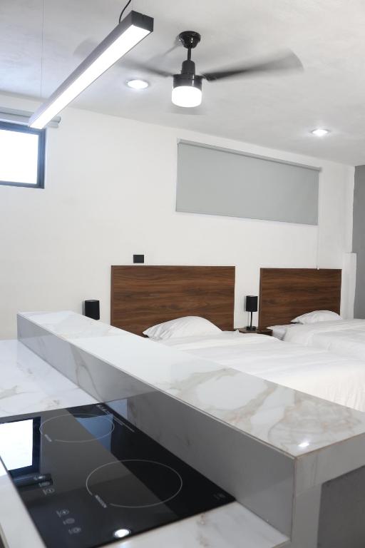 Postel nebo postele na pokoji v ubytování Apartamentos 31