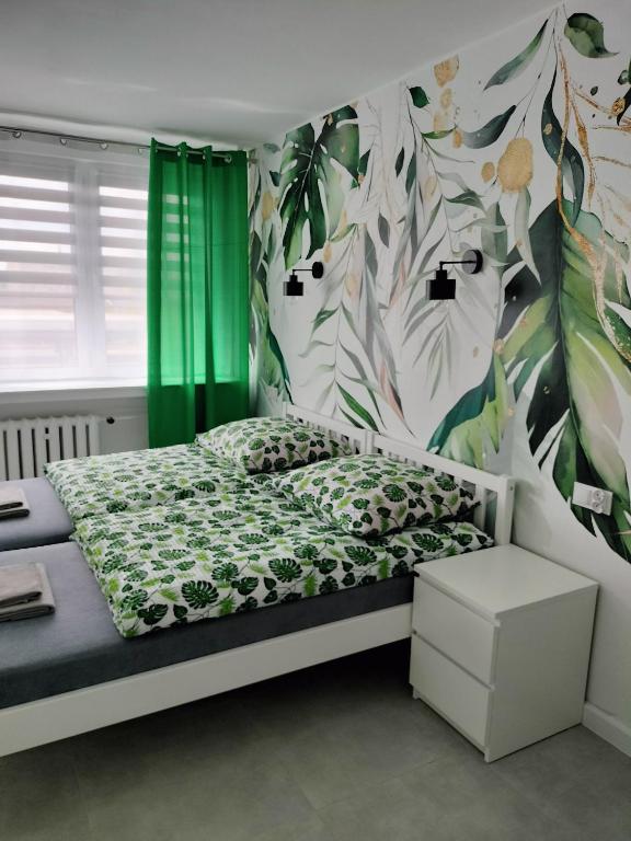 Posteľ alebo postele v izbe v ubytovaní Apartamenty Częstochowa