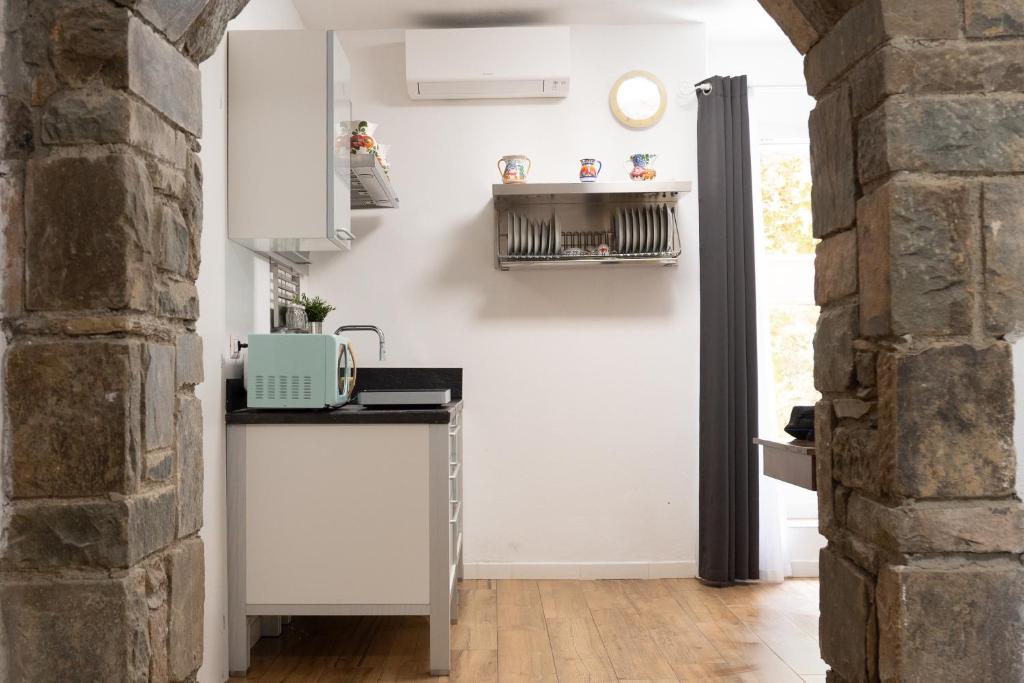 Kuchyň nebo kuchyňský kout v ubytování Alba apartments