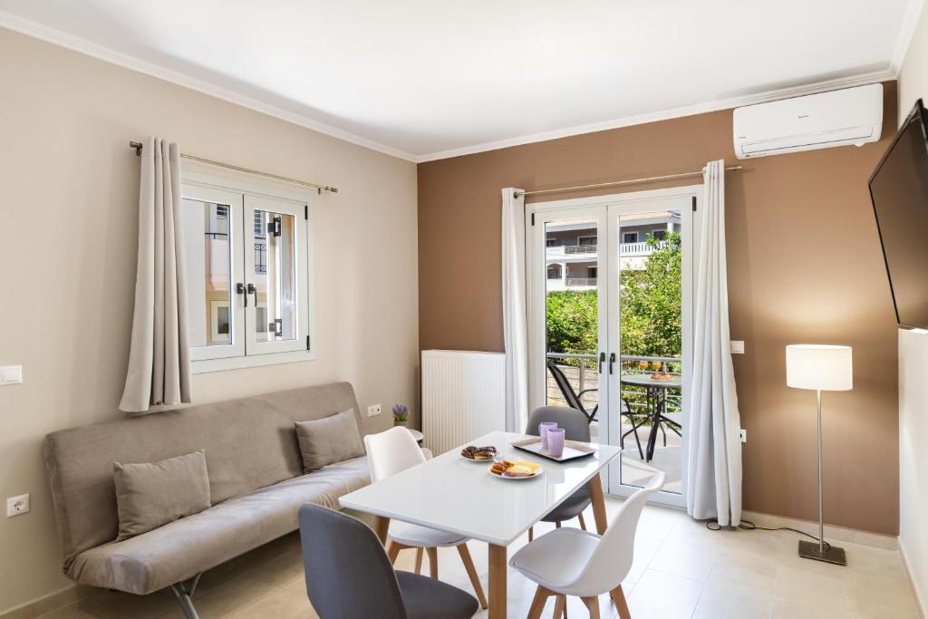 a living room with a couch and a table at K city apartments in Lefkada Town