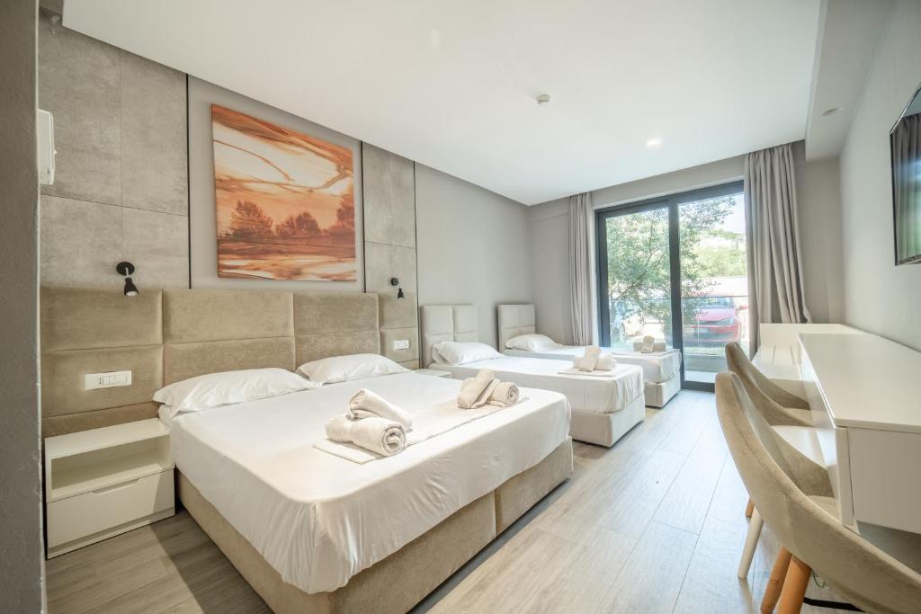 Voodi või voodid majutusasutuse Hotel Qeparo toas