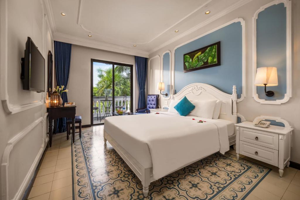 Giường trong phòng chung tại Hoi An Rosemary Boutique Hotel & Spa - A Peaceful Retreat