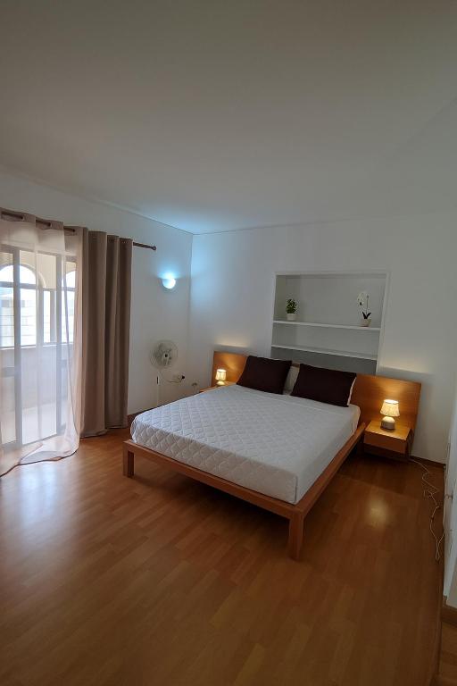 Postel nebo postele na pokoji v ubytování Casa TIANA