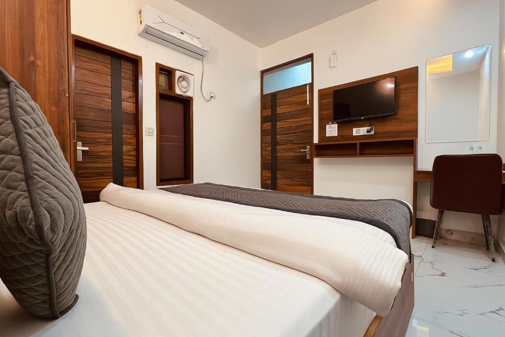 Postel nebo postele na pokoji v ubytování Aerovilla by JMD Group
