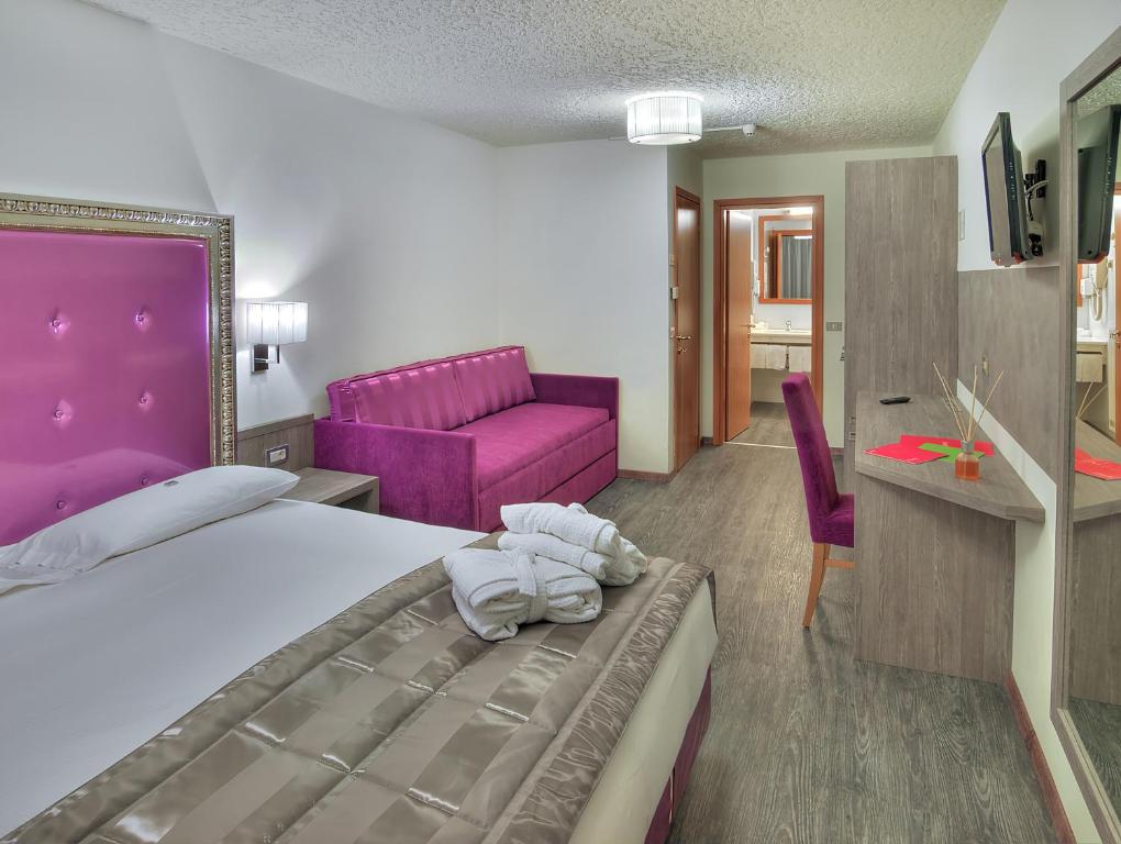 Postel nebo postele na pokoji v ubytování Luna Wellness Hotel