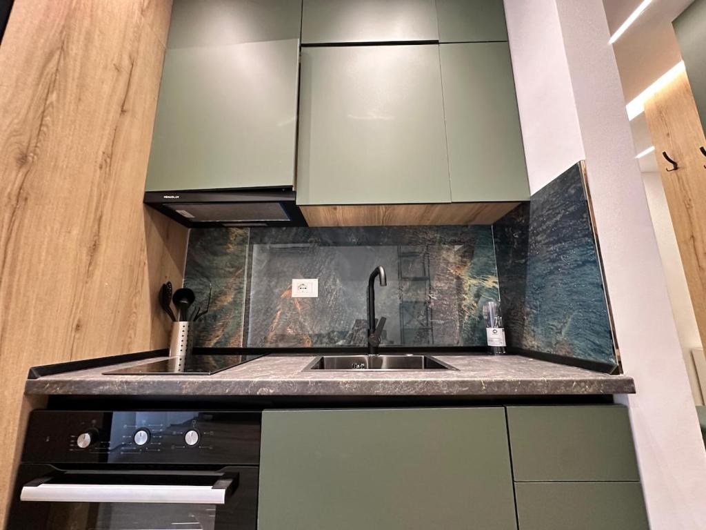 a kitchen with a sink and a counter top at Seaside Escape Apartment 6 in Golem