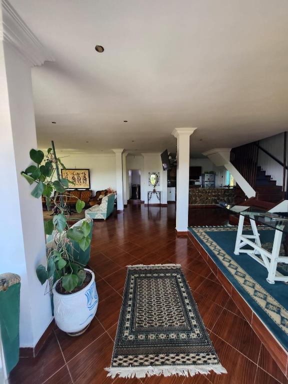 a living room with a couch and a table at Villa BleuBlanca Tangier in Tangier