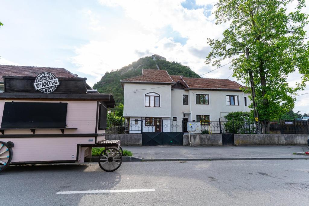 a horse drawn carriage parked in front of a house at Vila Mihu Cetate in Deva