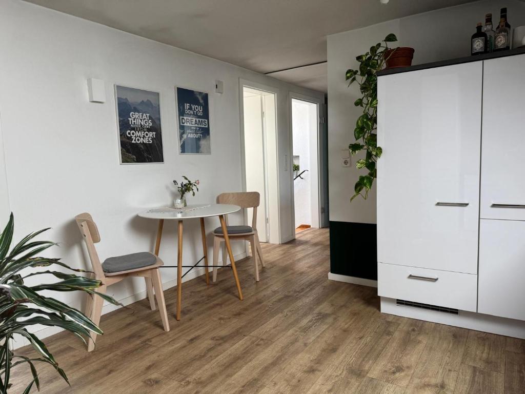 a living room with a table and chairs at Apartment Zum Wohlfühlen in Sulz am Neckar