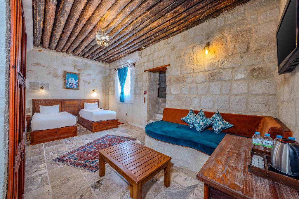 Postel nebo postele na pokoji v ubytování MDC Cave Hotel