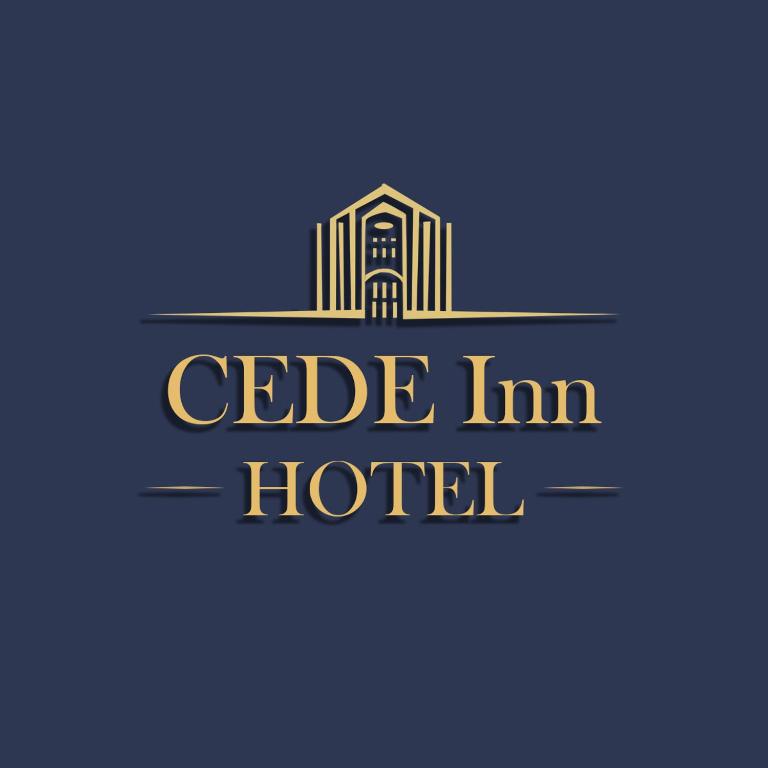 un logo per un hotel con un edificio di CEDE Inn Hotel a Encarnación