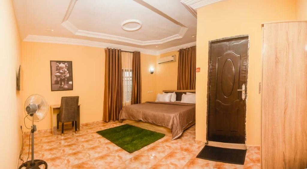 Voodi või voodid majutusasutuse Sisco Hotels and suites toas