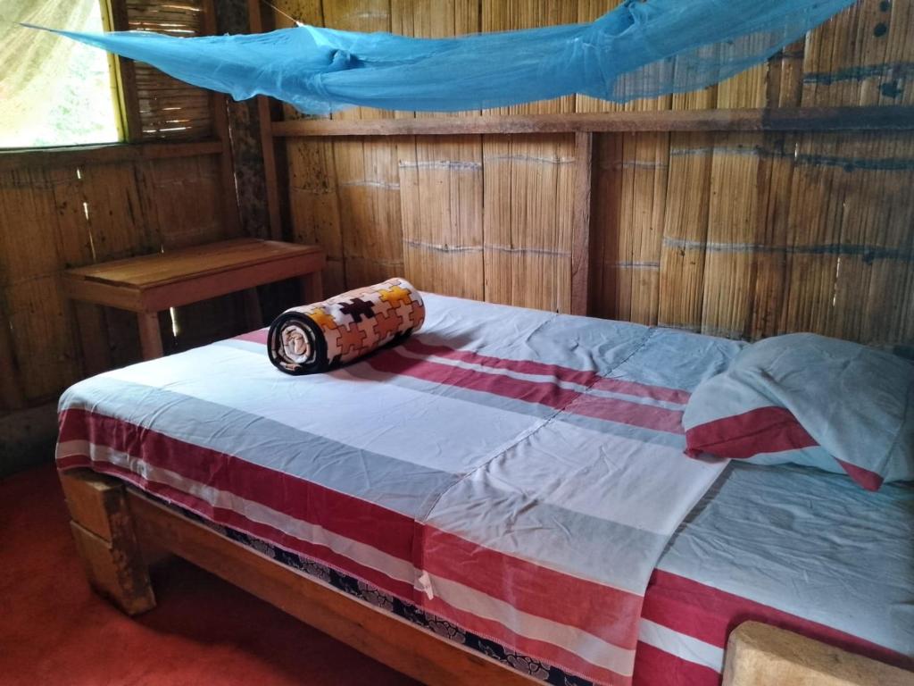Postel nebo postele na pokoji v ubytování Pihualli Lodge