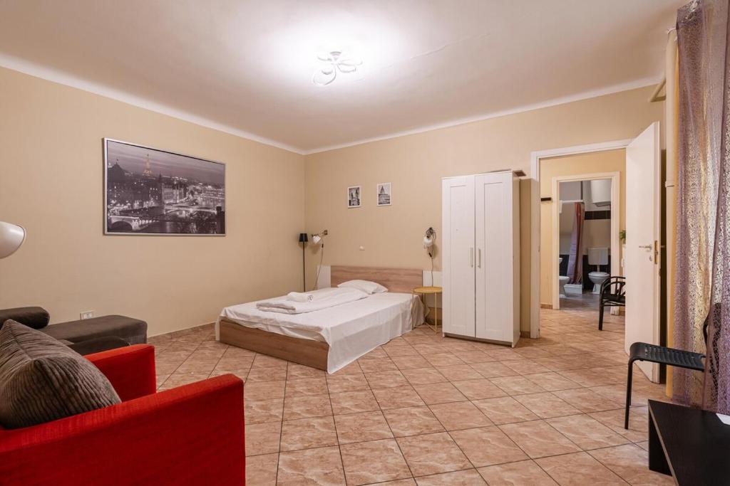 a bedroom with a bed and a living room at EcoStay Apartment by the Basilica in Budapest