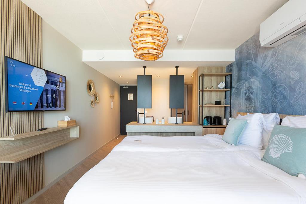Postel nebo postele na pokoji v ubytování Beachfront Boutiquehotel