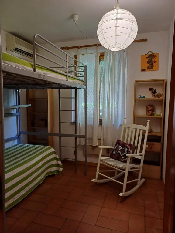 Postel nebo postele na pokoji v ubytování CASA VACANZE IN CAPRAIA ISOLA