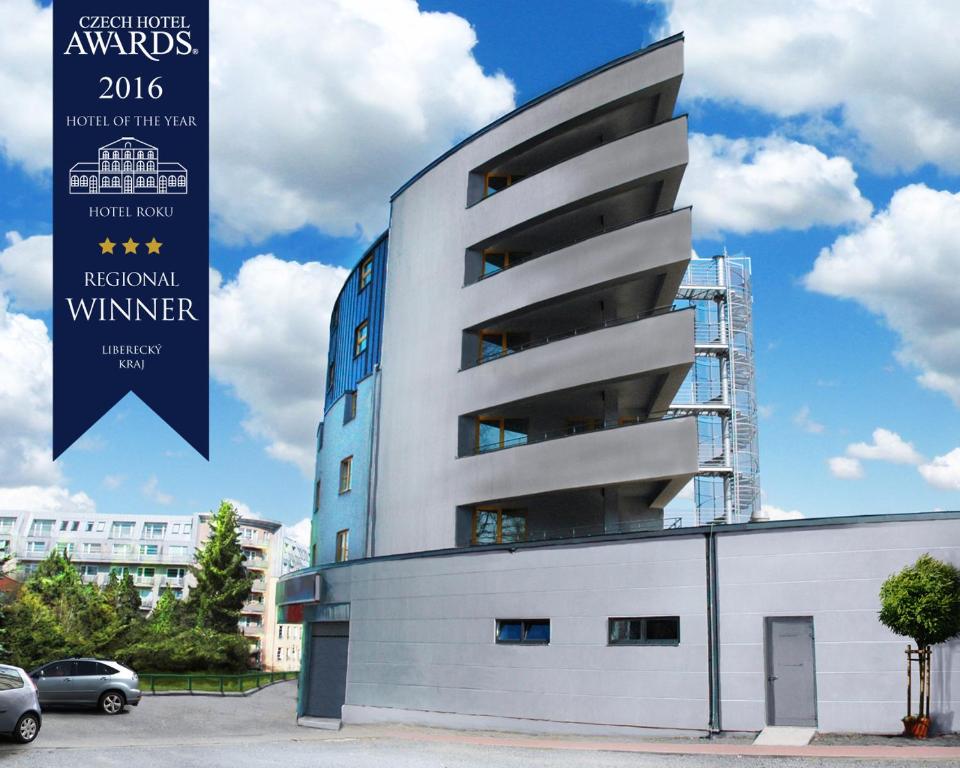 a building with a sign that reads regional winner at Hotel Arena in Liberec