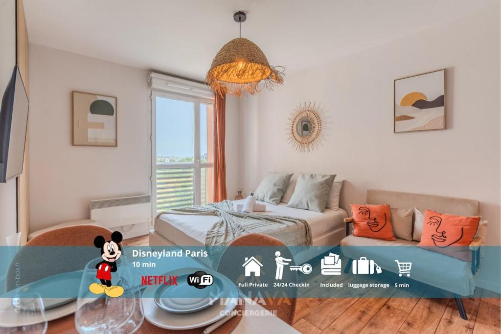 a room with a bed and a couch and a table at Le Tahiti, 2 pers, 10 min Disneyland Paris in Marne-la-Vallée