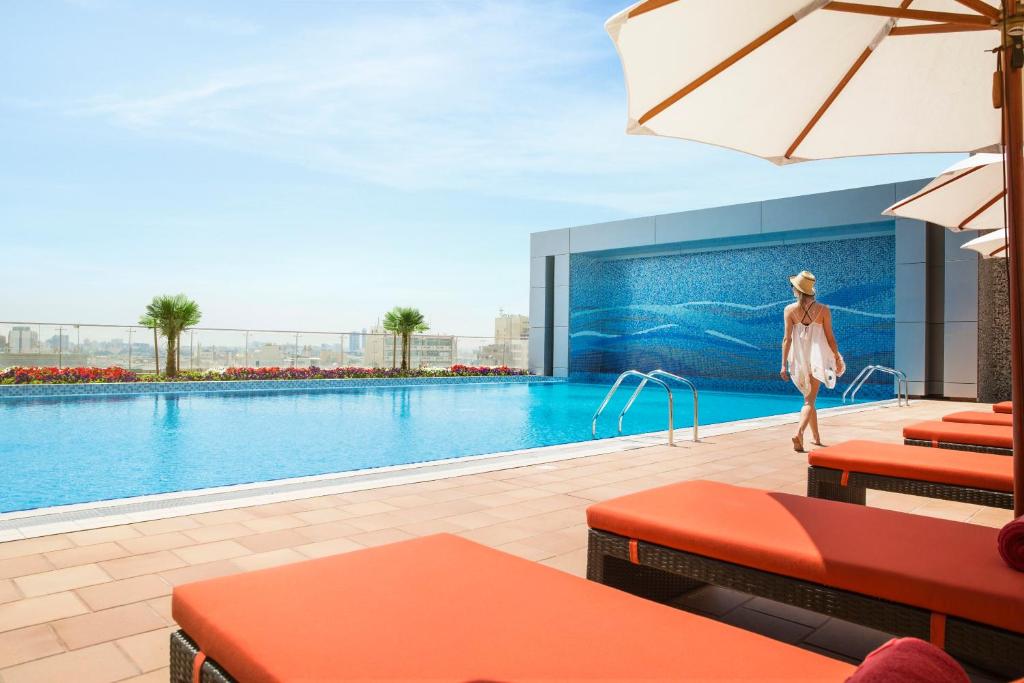 a rendering of the pool at a hotel at Downtown Rotana in Manama