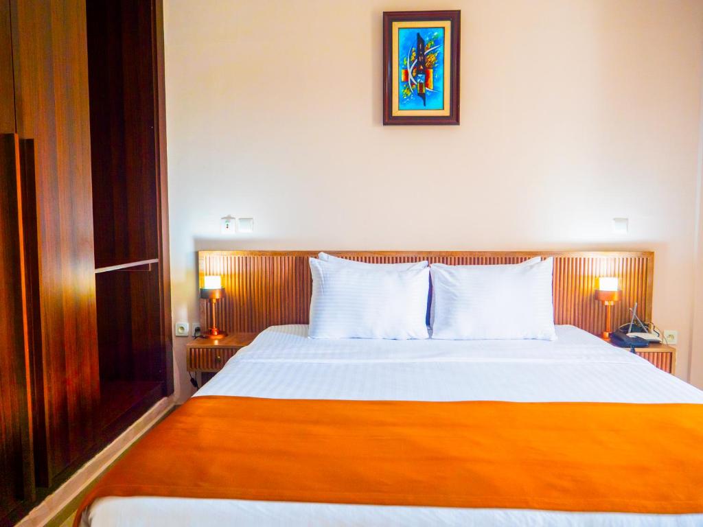 Postel nebo postele na pokoji v ubytování Hôtel KEMAKA