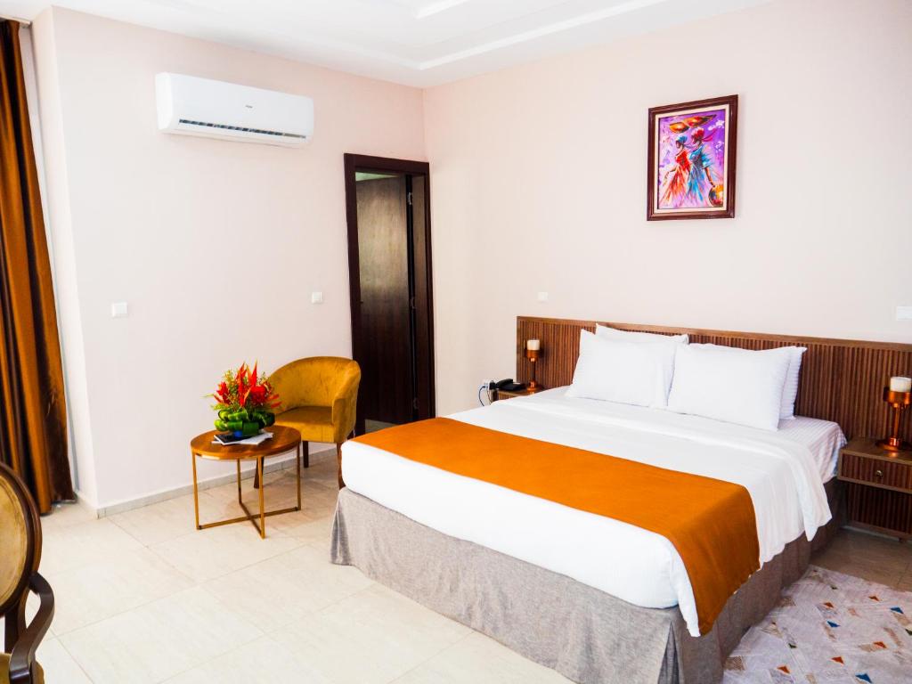 Postel nebo postele na pokoji v ubytování Hôtel KEMAKA