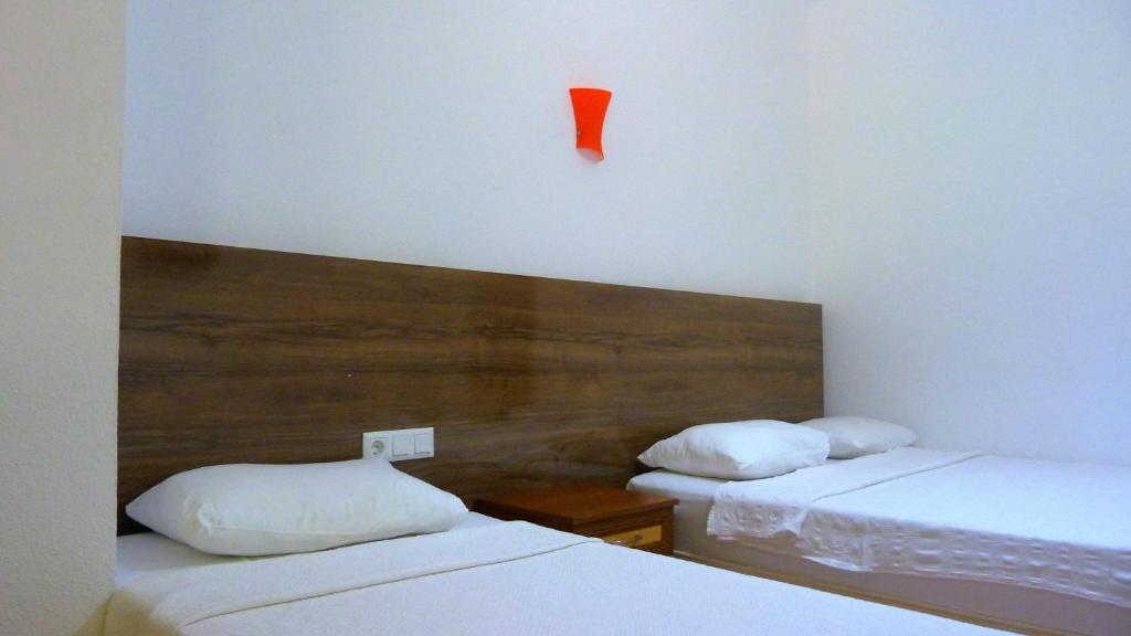 Postel nebo postele na pokoji v ubytování Simge Pension
