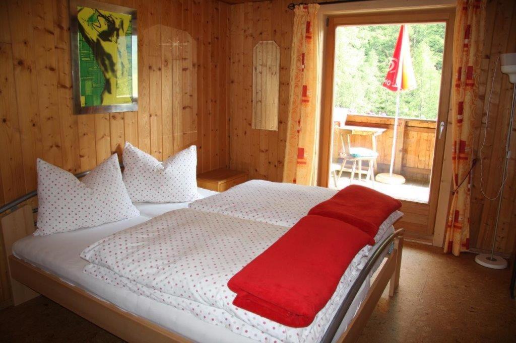 Postel nebo postele na pokoji v ubytování Berghaus Außergschlöß