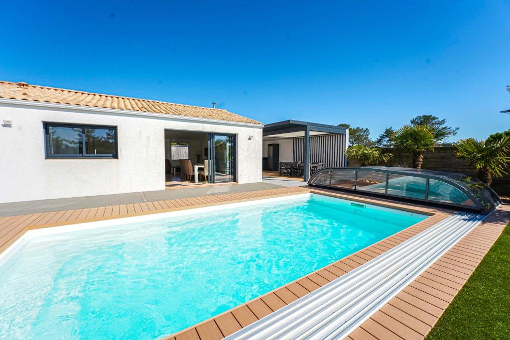 Bazén v ubytování Villa du golf - proche plage nebo v jeho okolí