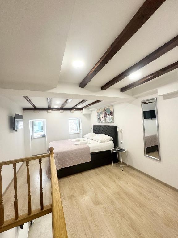 Posteľ alebo postele v izbe v ubytovaní Apartman Mama Marija