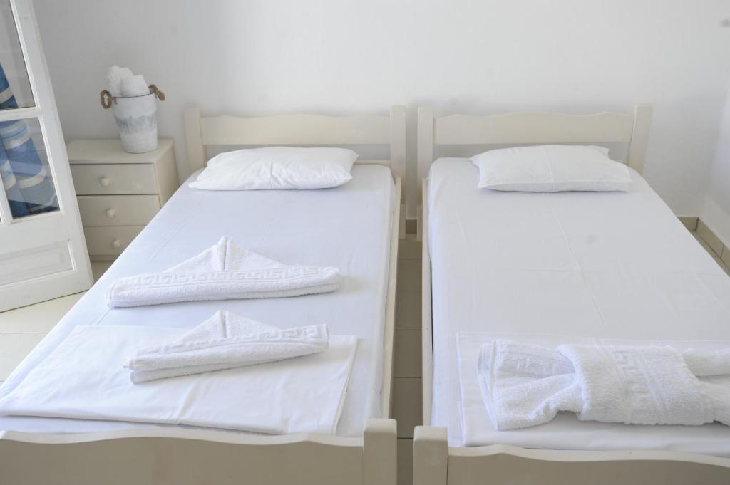 Postel nebo postele na pokoji v ubytování Galatis Beach Hotel