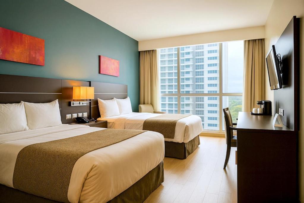 Uma cama ou camas num quarto em Tryp by Wyndham Panama Centro