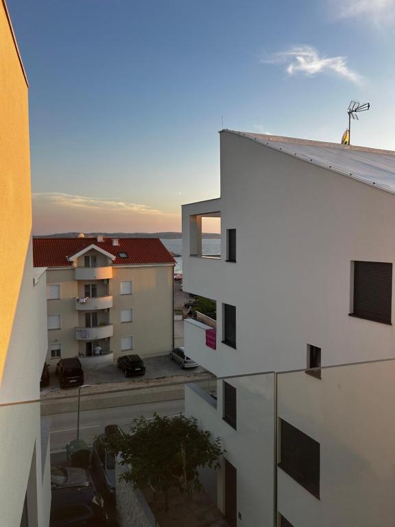 a view from the balcony of an apartment building at Apartment 98A7 in Povljana