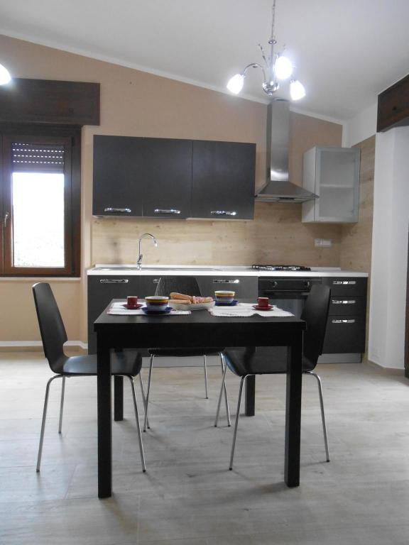 A kitchen or kitchenette at Casa Vacanze Villa Rosetta