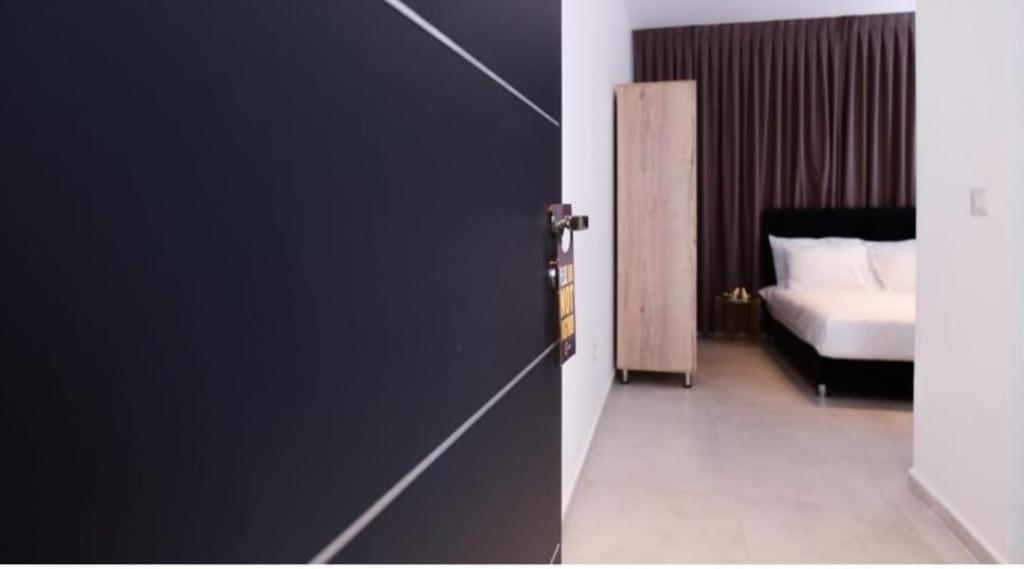 Ein Bett oder Betten in einem Zimmer der Unterkunft Sun Sea Center