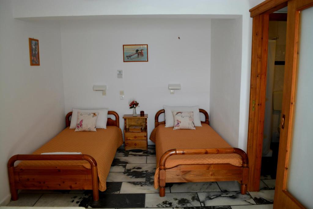 Postel nebo postele na pokoji v ubytování Dimitra Studios