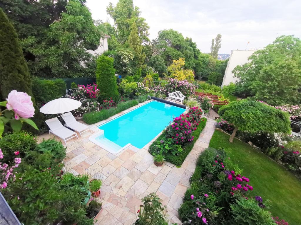 an overhead view of a swimming pool in a garden at Hillside Apartment with AC & heating in Grande Maison in Budapest