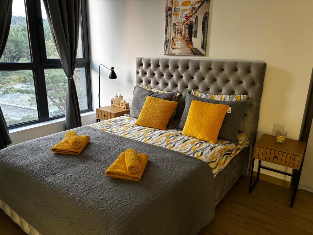 Llit o llits en una habitació de Apartman Yellow Moon