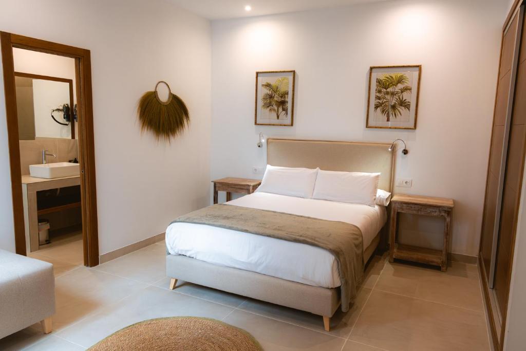 Ένα ή περισσότερα κρεβάτια σε δωμάτιο στο Apartamentos JR Alborada