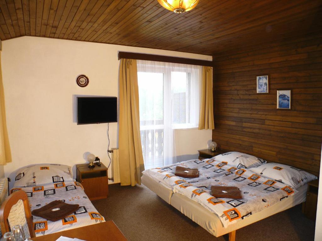 Postel nebo postele na pokoji v ubytování Pension Faema