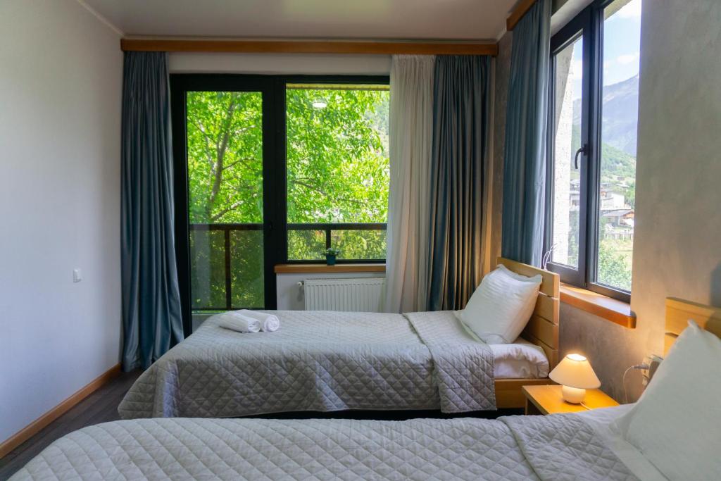 Postel nebo postele na pokoji v ubytování Lastili Inn Hotel