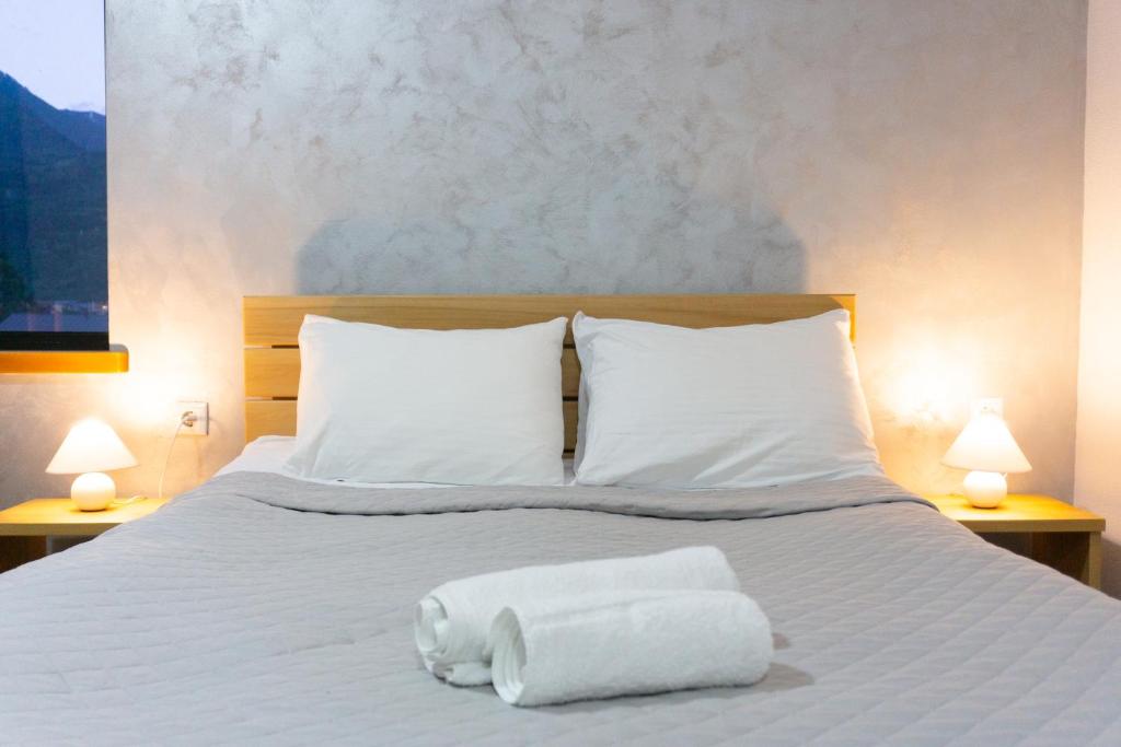 Postel nebo postele na pokoji v ubytování Lastili Inn Hotel