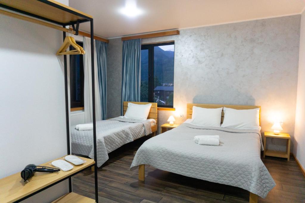 Postel nebo postele na pokoji v ubytování Lastili Inn Hotel