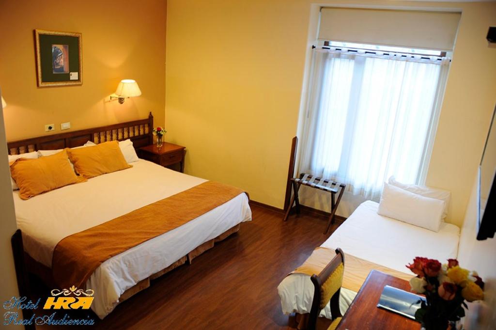 Postel nebo postele na pokoji v ubytování Hotel Real Audiencia