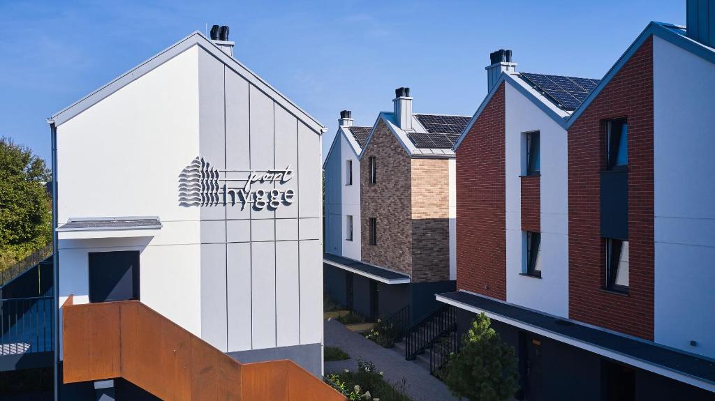 a building with a sign on the side of it at Na Pokładzie e-apart in Jastrzębia Góra