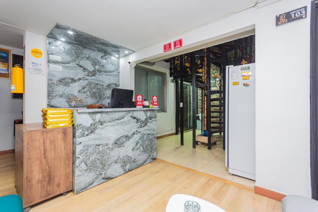 Kuchyň nebo kuchyňský kout v ubytování Hotel Lares 70 Laureles