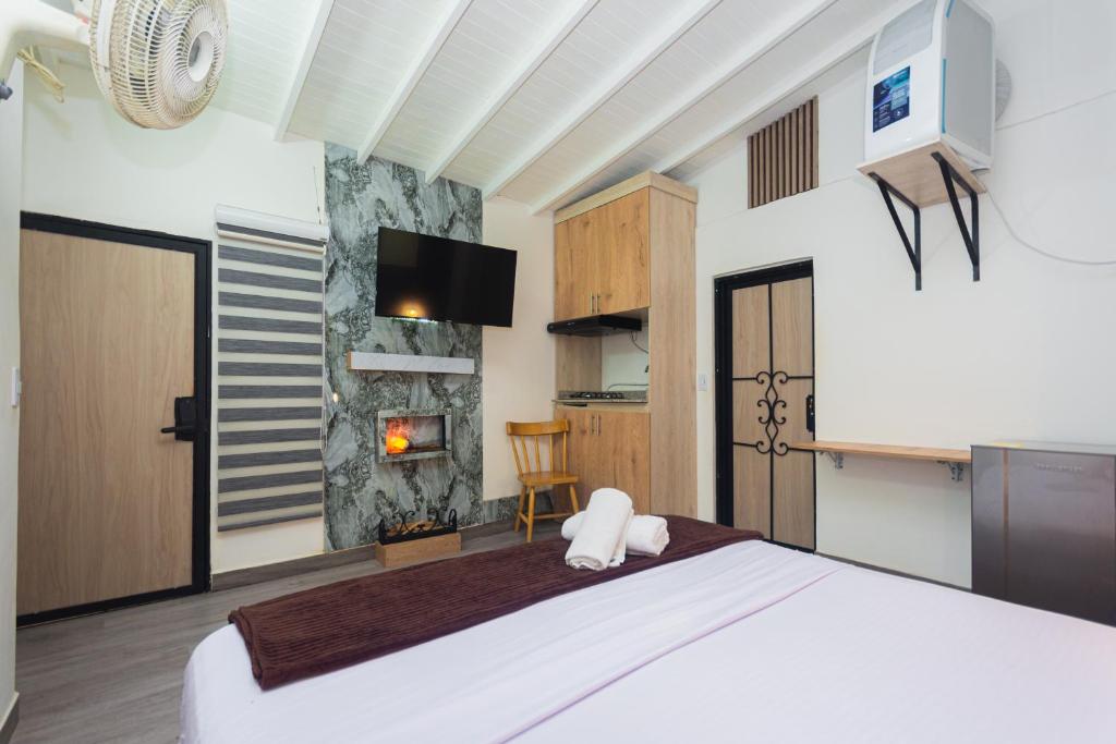 Postel nebo postele na pokoji v ubytování Hotel Lares 70 Laureles