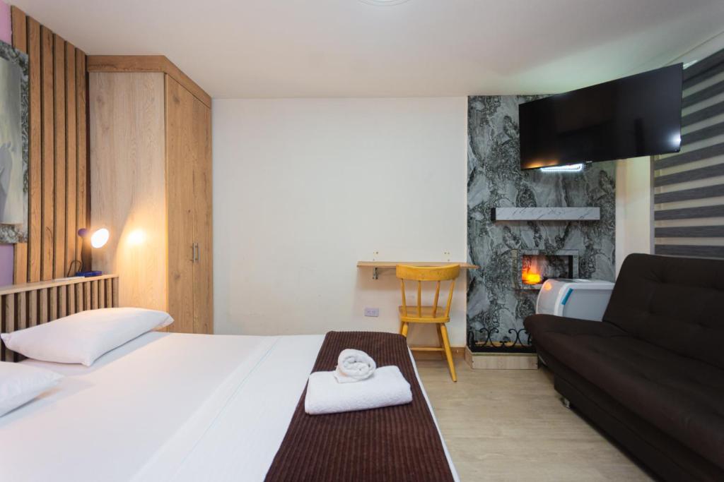 Postel nebo postele na pokoji v ubytování Hotel Lares 70 Laureles